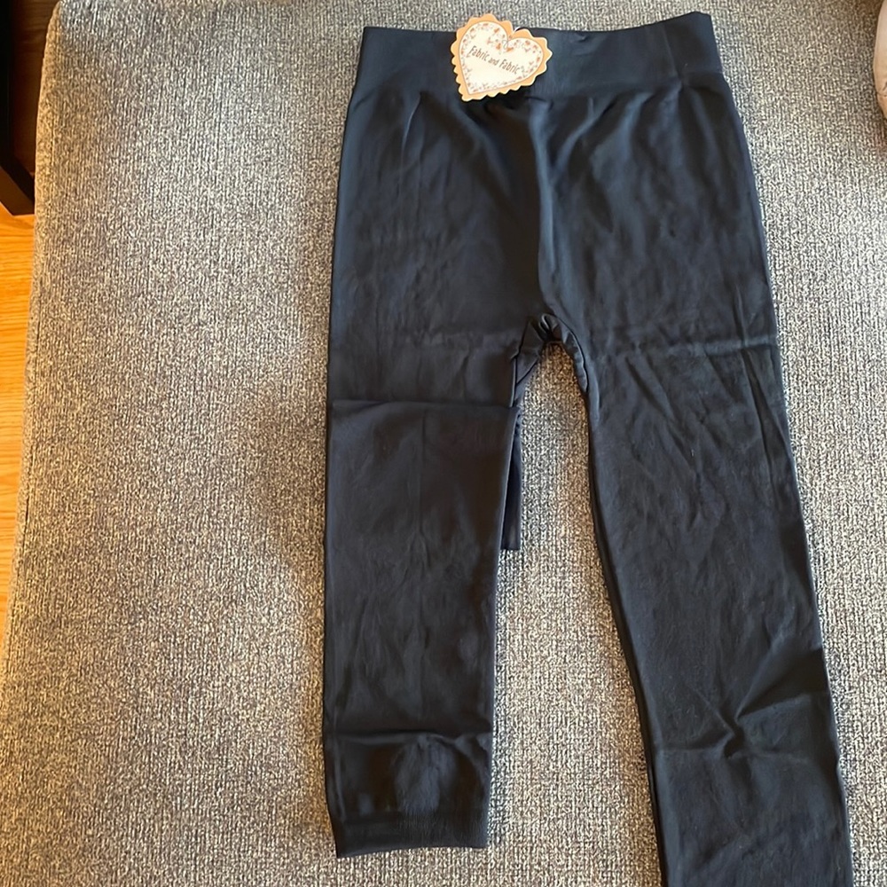 Fabric and Fabric. Black leggings. Brand new with tags. One size fits all.
